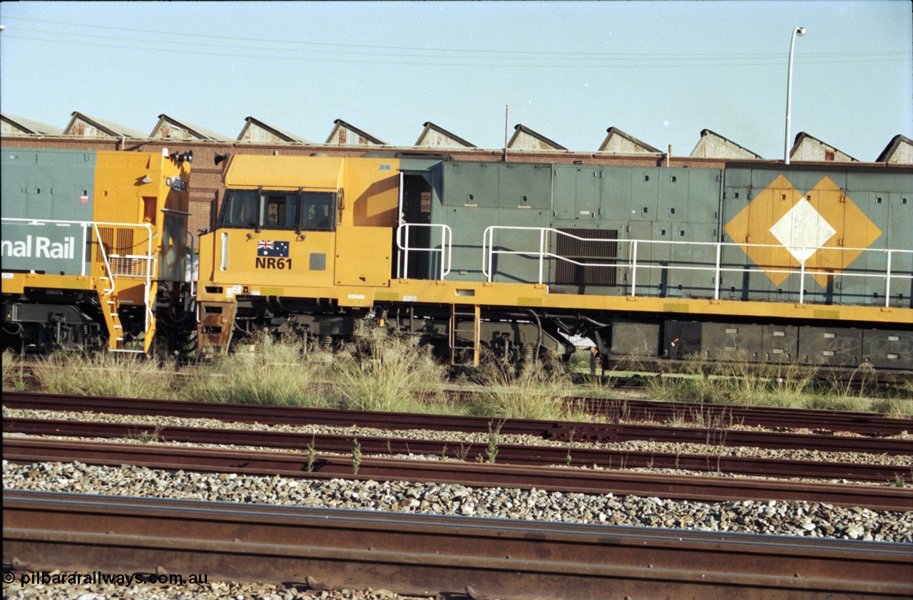 186-35
Midland, standard gauge yard, the first completed and built in Bassendean, National Rail NR class NR 61 Goninan GE model Cv40-9i serial 7250-11/96-263 trails new sister NR 101 in this drivers side shot.
Keywords: NR-class;NR61;Goninan;GE;Cv40-9i;7250-11/96-263;