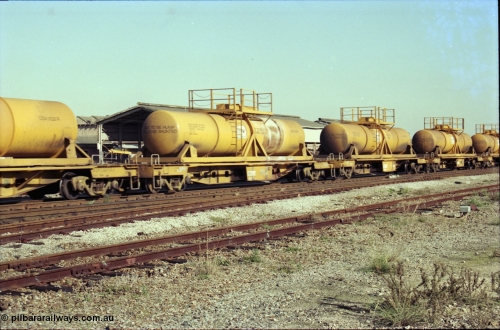 186-16
Midland, Westrail standard gauge WQH type bogie flat waggon WQH 30117 with CSA 0025 tank, originally built by WAGR Midland Workshops as WF type in 1965/66 and one of seventy five such waggons converted in 1997 to WQH from former WFDF/RFDF type waggons to carry CSA type sulphuric acid tanks, train number 428 loaded service, the empty train number was 027.
Keywords: WQH-type;WQH30117;WAGR-Midland-WS;WF-type;WFDY-type;WFDF-type;RFDF-type;AQHY-type;