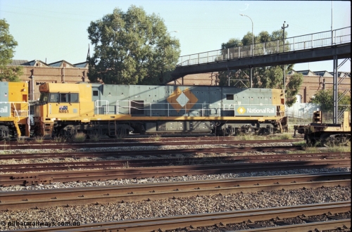 186-29
Midland, standard gauge yard, under the Midland Workshops footbridge, the first completed and built in Bassendean National Rail NR class NR 61 Goninan GE model Cv40-9i serial 7250-11/96-263 trails new sisters NR 101 and NR 102 as they perform their shunt movement.
Keywords: NR-class;NR61;Goninan;GE;Cv40-9i;7250-11/96-263;