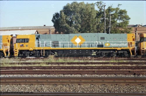 186-30
Midland, standard gauge yard, brand new Perth built National Rail NR class locomotive NR 101 Goninan built GE model Cv40-9i serial 7250-07/97-303 sits between sisters NR 101 and NR 61 as they undertake a shunting movement.
Keywords: NR-class;NR101;Goninan;GE;Cv40-9i;7250-07/97-303;