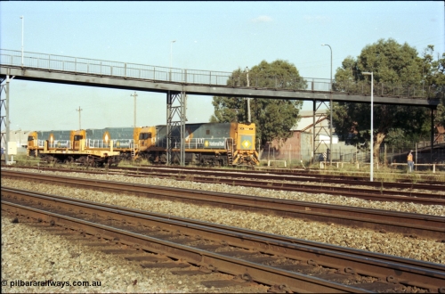 186-31
Midland, standard gauge yard, brand new Perth built National Rail NR class units NR 102 Goninan GE model Cv40-9i serial 7250-07/97-302 and NR 101 serial 7250-07/97-303 shunt out of the yard with the first built sister NR 61 serial 7250-11/96-263.
Keywords: NR-class;NR61;Goninan;GE;Cv40-9i;7250-11/96-263;