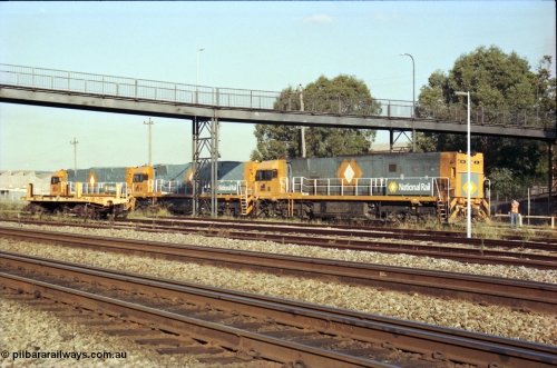 186-33
Midland, standard gauge yard, brand new Perth built National Rail NR class units NR 102 Goninan GE model Cv40-9i serial 7250-07/97-302 and NR 101 serial 7250-07/97-303 shunt out of the yard with the first built sister NR 61 serial 7250-11/96-263.
Keywords: NR-class;NR61;Goninan;GE;Cv40-9i;7250-11/96-263;