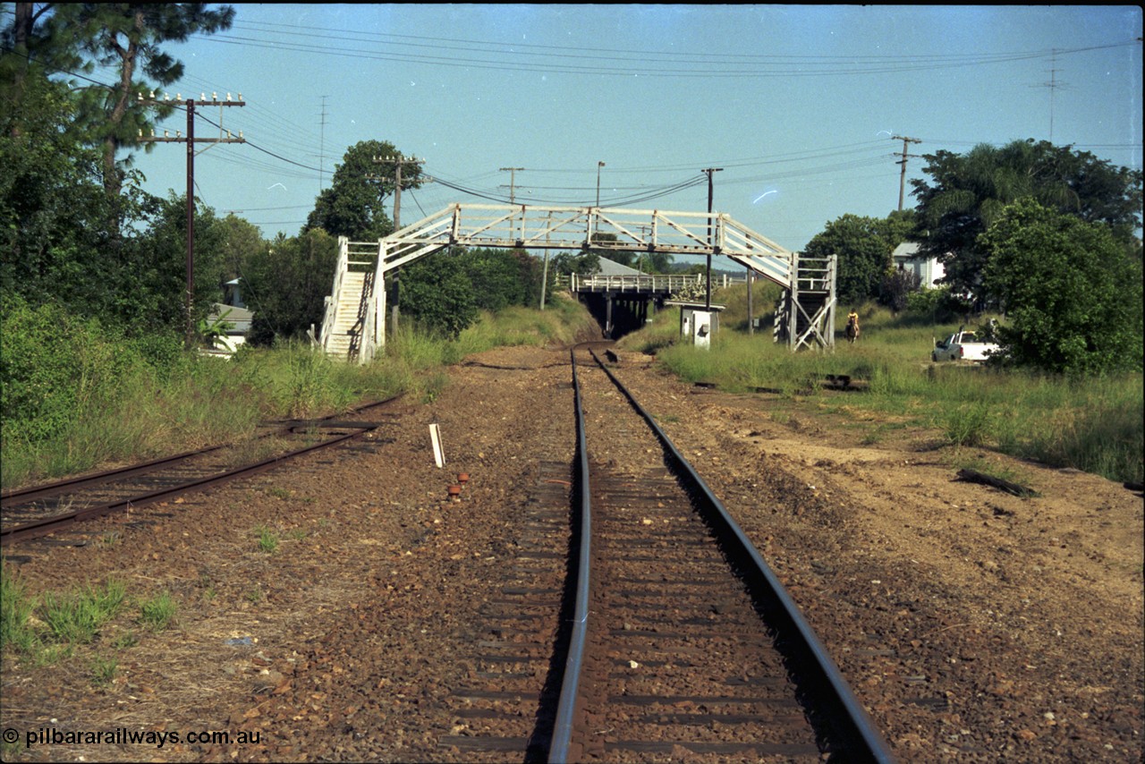 187-01
Nashville, Gympie Queensland. View looking south in the Up direction, footbridge still intact, low level platform and passenger shelter, Graham St overbridge in distance. Ute on the right would be on what is now Nashville Lane. [url=https://goo.gl/maps/q1dyp7EeiNB2]GeoData[/url].
