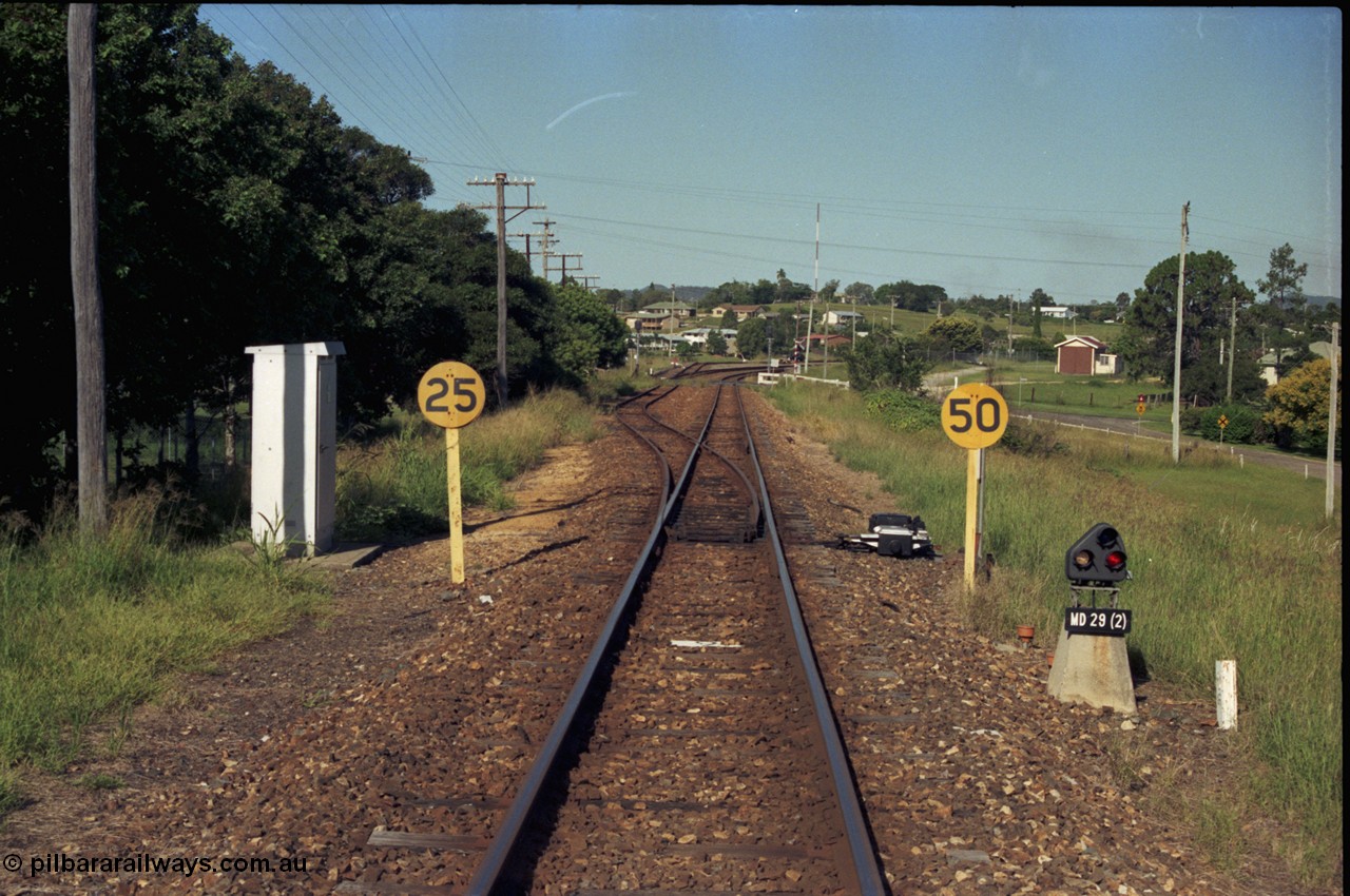 187-04
Monkland, Gympie Queensland. View looking east in the Up direction with the Brisbane Rd grade crossing in the distance. [url=https://goo.gl/maps/bfihzfQbhgN2]GeoData[/url].
