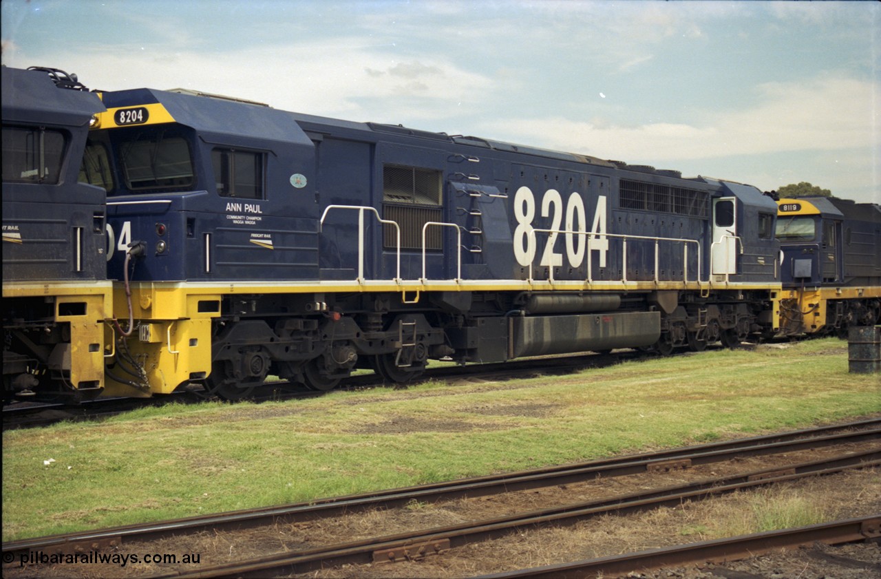 187-25
Yeerongpilly, NSWSRA standard gauge loco depot, 82 class Clyde Engineering built EMD model JT42C unit 8204 'Ann Paul - Wagga Wagga' serial 94-1311. [url=https://goo.gl/maps/MTvf4SEKLkJ2]GeoData[/url].
Keywords: 82-class;8204;Clyde-Engineering-Braemar-NSW;EMD;JT42C;94-1311;