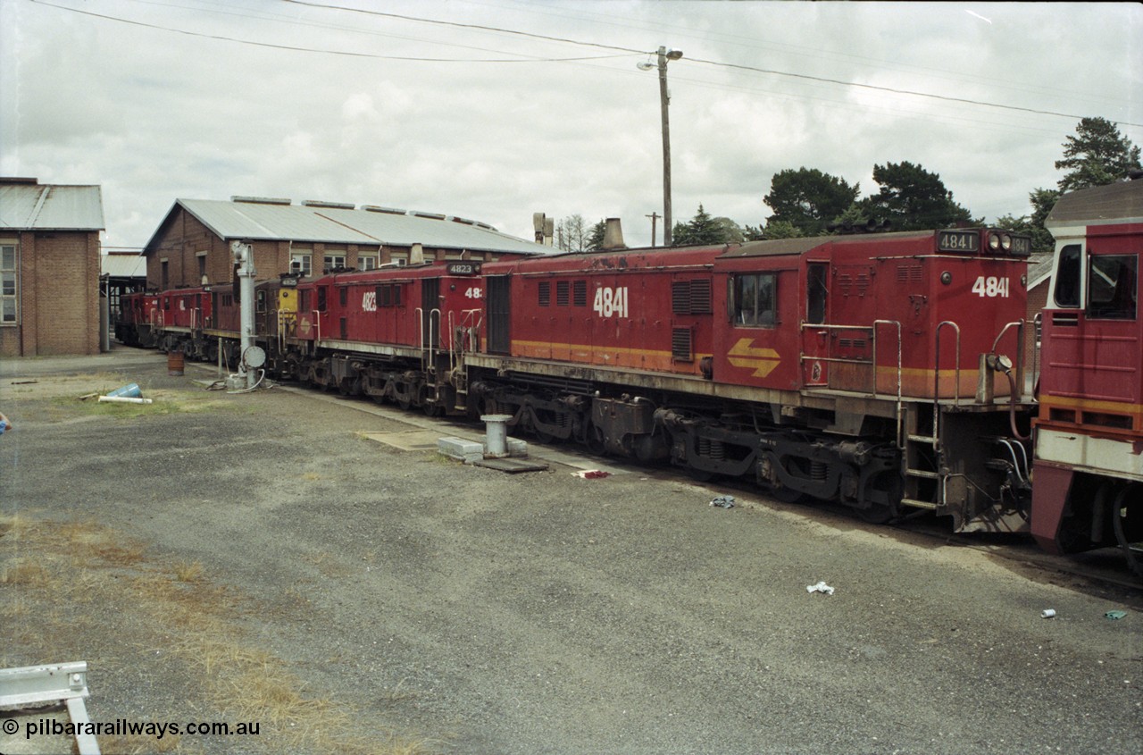 188-33
Junee, NSWSRA standard gauge locomotive depot, 48 class MK I unit 4841 serial 84131 in candy livery, built by AE Goodwin as ALCo model DL531 is joined by three sister units.
Keywords: 48-class;4841;AE-Goodwin;ALCo;DL531;84131;