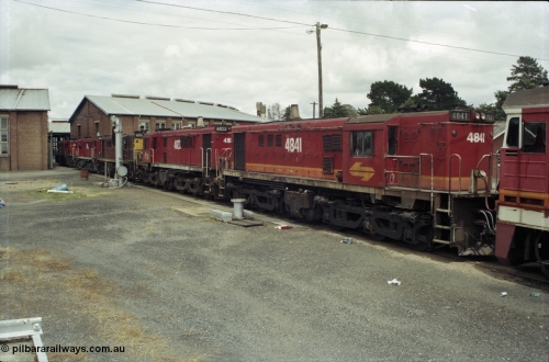 188-33
Junee, NSWSRA standard gauge locomotive depot, 48 class MK I unit 4841 serial 84131 in candy livery, built by AE Goodwin as ALCo model DL531 is joined by three sister units.
Keywords: 48-class;4841;AE-Goodwin;ALCo;DL531;84131;
