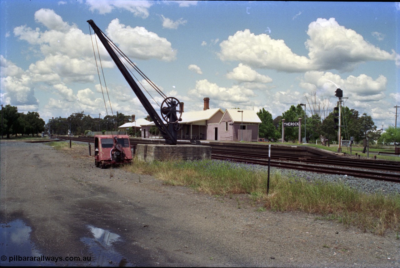 189-07
The Rock, located at the 550.29 km on NSW Main South line, station platform and building with the goods loading crane and track inspection car, the Back Road is visible mid frame at left.
