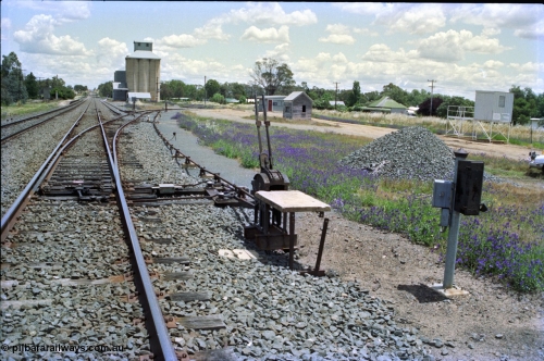 189-02
Uranquinty, located at the 535.72 km on the NSW Main South line, view looking south, view of the interlocking for ground frame B for the goods and grain sidings, the original and newer weighbridge buildings can be seen above the levers.

