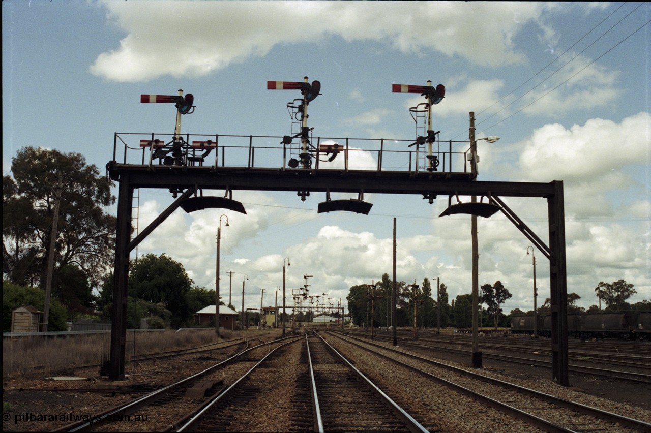 190-07
Cootamundra, NSW Main South, still looking north, another mechanical lower quadrant semaphore signal gantry.
