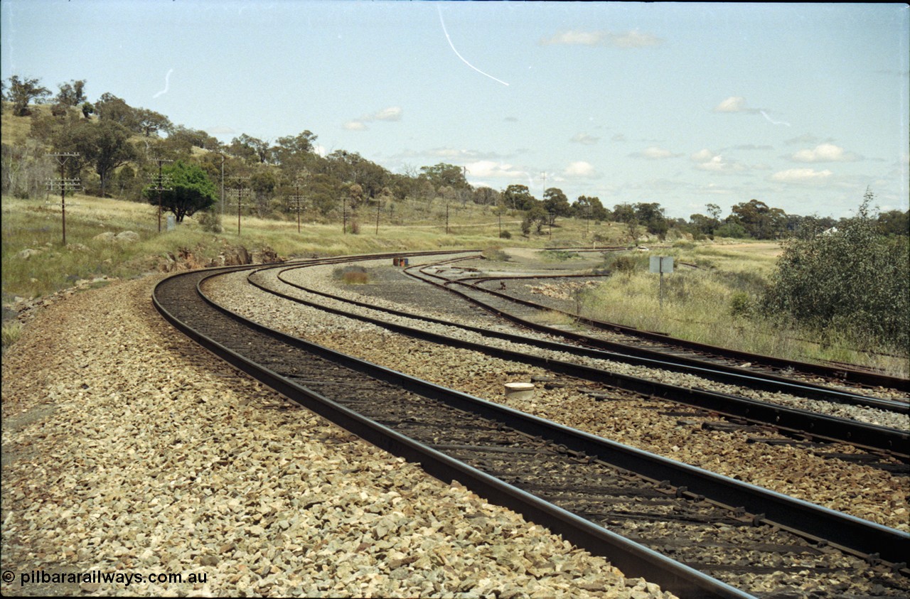 190-28
Bethungra, located at the 456.04 km on the NSW Main South line, looking south into the yard from the north end, far right road is the grain siding, then left is the goods siding.
