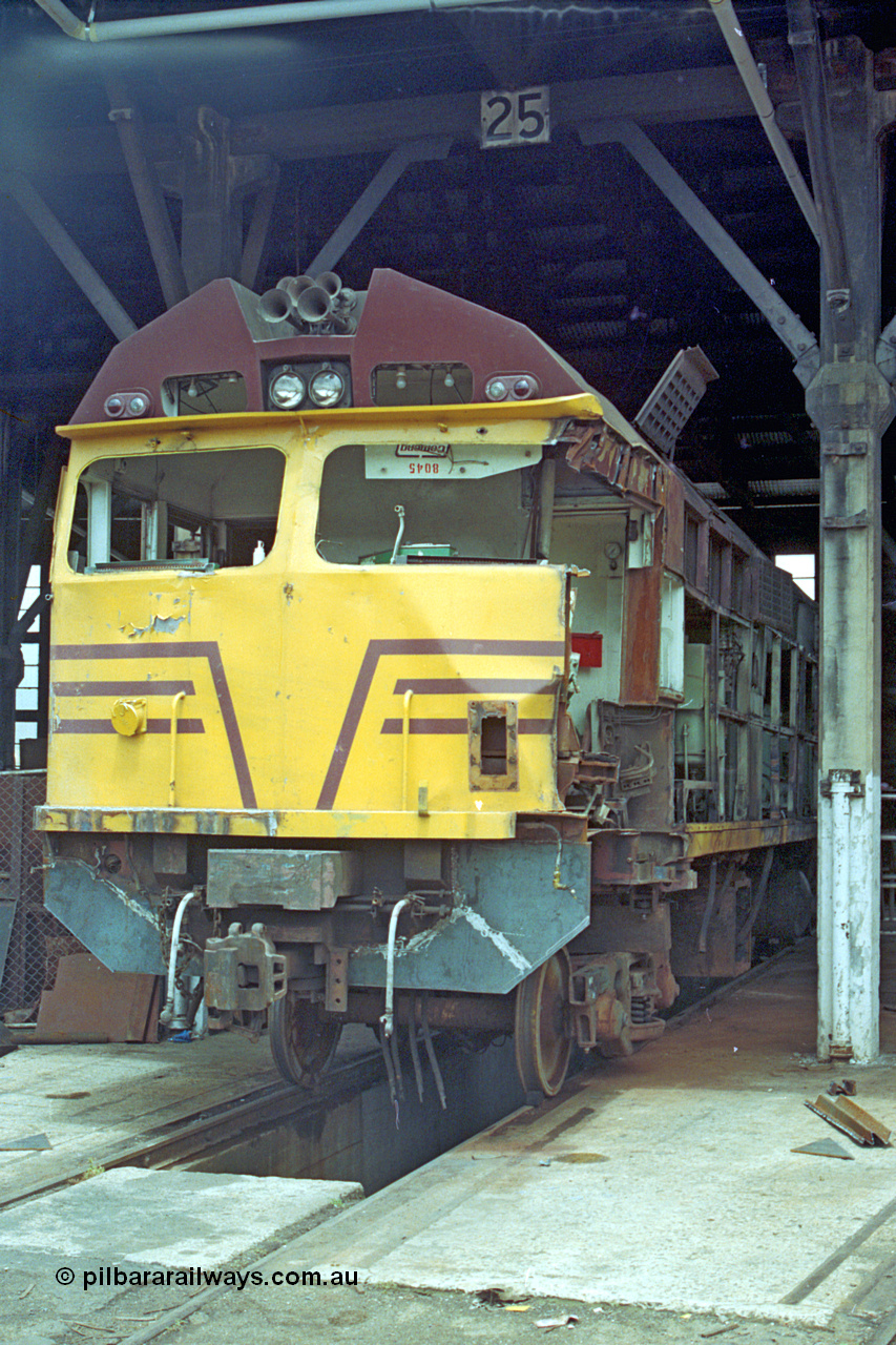 192-08
Junee, NSWSRA standard gauge locomotive depot, accident damaged NSWGR 80 class unit 8045 inside the roundhouse on road 25. An ALCo CE615A model with Mitsubishi electrics built by Comeng NSW in 1982 serial C6121-15.
Keywords: 80-class;8045;Comeng-NSW;ALCo;CE615A;C6121-15;
