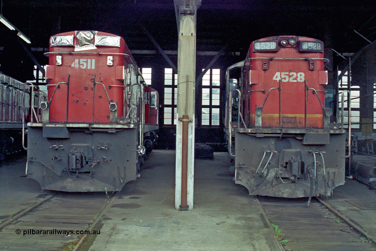 192-11
Junee, NSWSRA standard gauge locomotive depot roundhouse, a pair of ALCo RSD-20 or DL-541 models built by AE Goodwin for NSWGR as the 45 class are in the stages of being sealed up for long term storage, 4511 serial 84153 is already done while 4528 serial 84170 wait its turn.
Keywords: 45-class;4511;AE-Goodwin;ALCo;RSD-20;DL-541;4528;84153;84170;