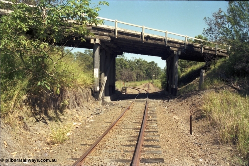 193-08
Moodlu quarry junction, looking west in the Down direction, quarry line curves away to the left, line continues around to the right to the site of Moodlu. The overbridge is marked as 5.150 km.
