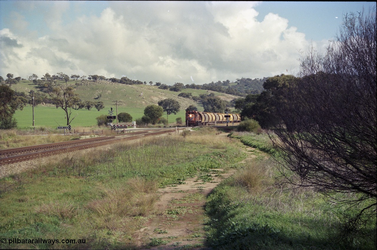 199-01
Toodyay West, empty grain train with standard gauge Westrail L class L 263 Clyde Engineering EMD GT26C serial 68-553 and forty empty waggons at Northam-Toodyay Rd Katrine. 1316 hrs on 21st June 1997.
Keywords: L-class;L263;Clyde-Engineering-Granville-NSW;EMD;GT26C;68-553;