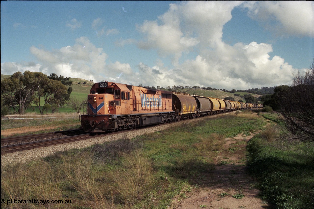 199-03
Toodyay West, empty grain train with standard gauge Westrail L class L 263 Clyde Engineering EMD GT26C serial 68-553 and forty empty waggons at Northam-Toodyay Rd Katrine. 1316 hrs on 21st June 1997.
Keywords: L-class;L263;Clyde-Engineering-Granville-NSW;EMD;GT26C;68-553;