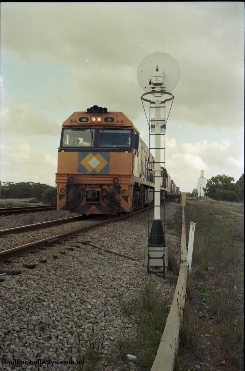 199-12
Meckering, National Rail NR class units NR 19 and NR 20 both being Goninan built GE Cv40-9i models head up train 7PM5 as they wait for a cross with the Prospector in the loop 1400 hrs 21st June 1997.
Keywords: NR-class;NR19;Goninan;GE;CV40-9i;7250-03/97-221;
