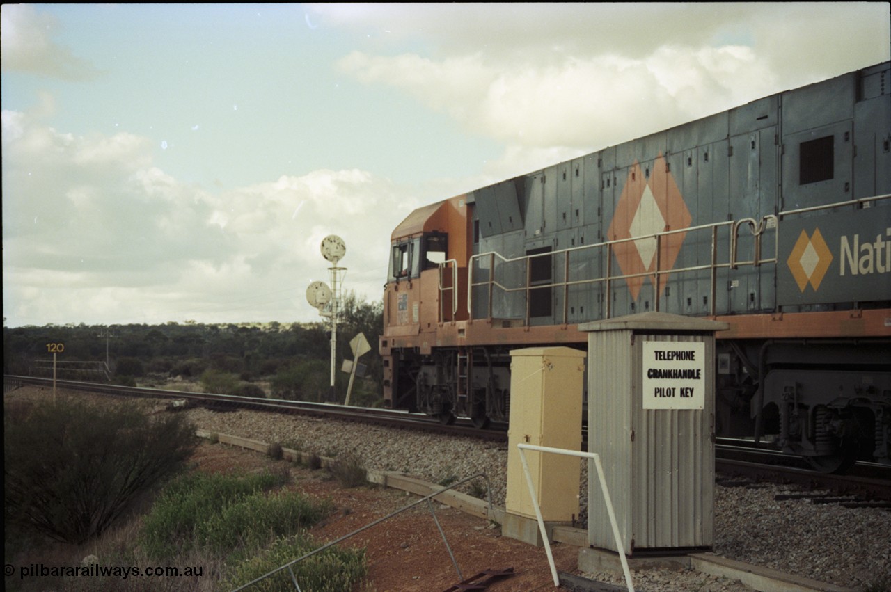 199-19
Meckering, National Rail NR class unit NR 19 Goninan built GE Cv40-9i model heads up train 7PM5 as it departs the loop 1400 hrs 21st June 1997.
Keywords: NR-class;NR19;Goninan;GE;CV40-9i;7250-03/97-221;
