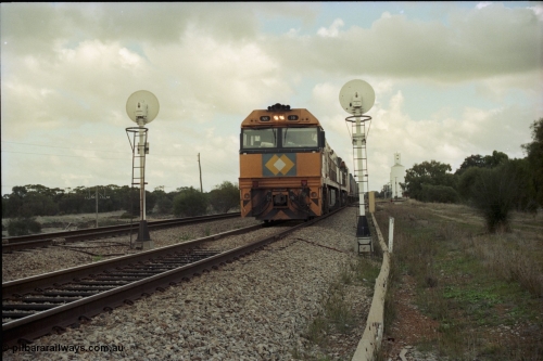 199-05
Meckering, National Rail NR class units NR 19 and NR 20 both being Goninan built GE Cv40-9i models head up train 7PM5 as they wait for a cross with the Prospector in the loop 1400 hrs June 21, 1997.
Keywords: NR-class;NR19;Goninan;GE;CV40-9i;7250-03/97-221;