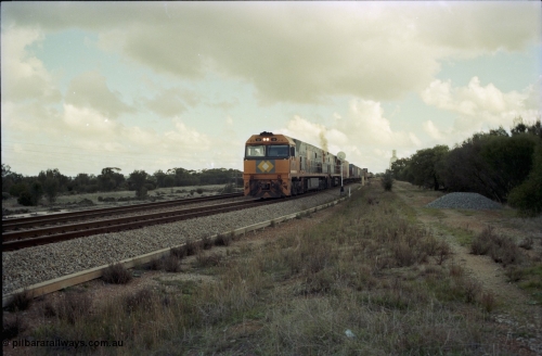 199-16
Meckering, National Rail NR class units NR 19 and NR 20 Goninan built GE Cv40-9i models lead train 7PM5 as they power out of the loop following a cross with the Prospector 1420 hrs June 21, 1997.
Keywords: NR-class;NR19;Goninan;GE;CV40-9i;7250-03/97-221;