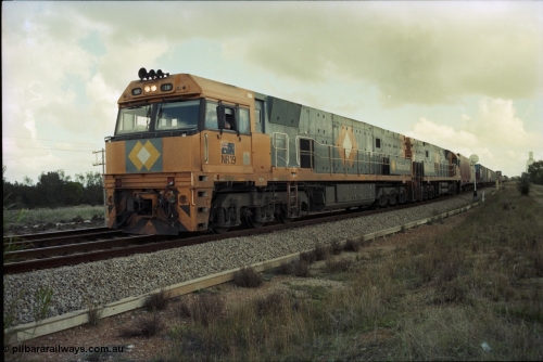 199-18
Meckering, National Rail NR class units NR 19 and NR 20 Goninan built GE Cv40-9i models lead train 7PM5 as they power out of the loop following a cross with the Prospector 1420 hrs June 21, 1997.
Keywords: NR-class;NR19;Goninan;GE;CV40-9i;7250-03/97-221;