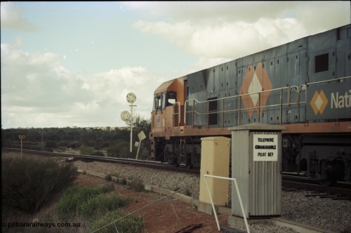 199-19
Meckering, National Rail NR class unit NR 19 Goninan built GE Cv40-9i model heads up train 7PM5 as it departs the loop 1400 hrs June 21, 1997.
Keywords: NR-class;NR19;Goninan;GE;CV40-9i;7250-03/97-221;