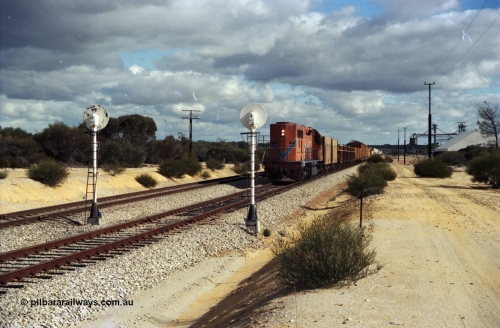 200-01
Moorine Rock, Westrail L class 271 Clyde Engineering EMD model GT26C serial 69-620 runs through the loop with the ballast cleaning train, known as the Circus Train while a Perth bound freighter sits in the mainline, June 22, 1997.
Keywords: L-class;L271;Clyde-Engineering-Granville-NSW;EMD;GT26C;69-620;