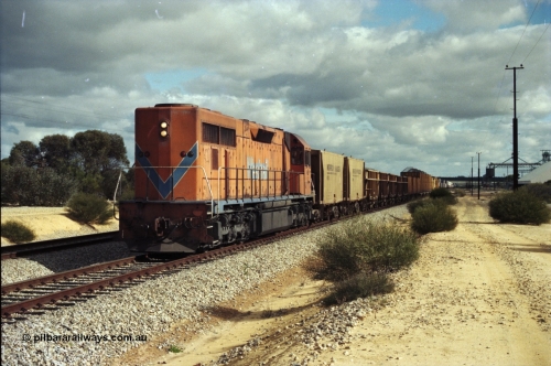 200-03
Moorine Rock, Westrail L class 271 Clyde Engineering EMD model GT26C serial 69-620 runs through the loop with the ballast cleaning train, known as the Circus Train while a Perth bound freighter sits in the mainline, June 22, 1997.
Keywords: L-class;L271;Clyde-Engineering-Granville-NSW;EMD;GT26C;69-620;
