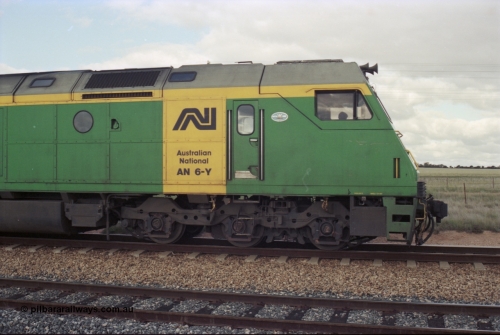 200-11
Moorine Rock, Australian National AN class AN 6 a Clyde Engineering built EMD model JT46C serial 93-1302, cab side view sits on the mainline with a Perth bound freight, 1500 hrs June 22, 1997.
Keywords: AN-class;AN6;Clyde-Engineering-Somerton-Victoria;EMD;JT46C;93-1302;
