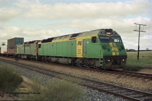 200-17
Moorine Rock, Australian National AN class AN 6 a Clyde Engineering built EMD model JT46C serial 93-1302 and ALF class 24 on the mainline with a Perth bound freight, June 22, 1997.
Keywords: AN-class;AN6;Clyde-Engineering-Somerton-Victoria;EMD;JT46C;93-1302;