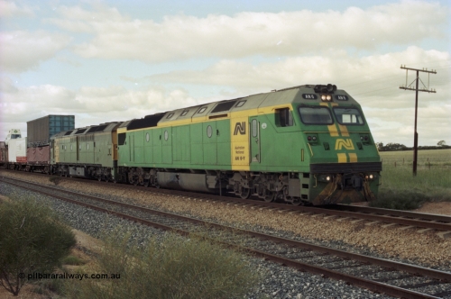 200-18
Moorine Rock, Australian National AN class AN 6 a Clyde Engineering built EMD model JT46C serial 93-1302 and ALF class ALF 24 on the mainline with a Perth bound freight, June 22, 1997.
Keywords: AN-class;AN6;Clyde-Engineering-Somerton-Victoria;EMD;JT46C;93-1302;
