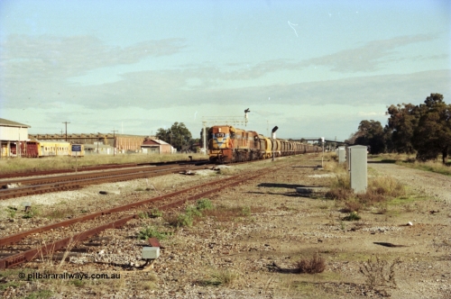 200-19
Midland, Westrail's Clyde Engineering built EMD model G26C as the DA class, DA 1573 serial 72-760 and DA 1574 serial 72-761 lead an empty grain train to Avon past the Midland Workshops at 0925 hrs June 24, 1997.
Keywords: DA-class;DA1573;Clyde-Engineering-Granville-NSW;EMD;G26C;72-760;