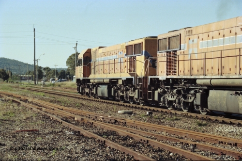 200-23
Midland, Westrail's Clyde Engineering built EMD model G26C as the DA class, DA 1573 serial 72-760 and DA 1574 serial 72-761 lead an empty grain train to Avon near the Lloyd Street grade crossing, 0925 hrs June 24, 1997.
Keywords: DA-class;DA1573;Clyde-Engineering-Granville-NSW;EMD;G26C;72-760;