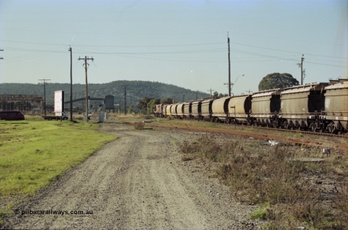 200-25
Midland, Westrail's Clyde Engineering built EMD model G26C as the DA class, DA 1573 serial 72-760 and DA 1574 serial 72-761 lead an empty grain train to Avon across the Lloyd Street grade crossing, 0925 hrs June 24, 1997.
Keywords: DA-class;DA1573;Clyde-Engineering-Granville-NSW;EMD;G26C;72-760;