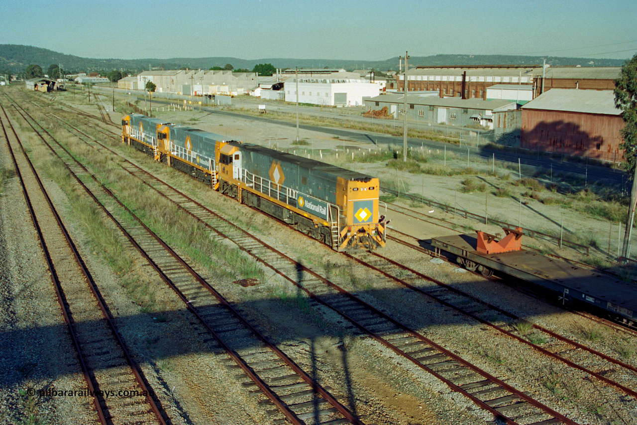 201-14
Midland, the first Perth built NR class NR 61 Goninan GE model Cv40-9i serial 7250-11/96-263 shunts at Midland with two brand new NR units and waggon RQRX type RQRX 60177.
Keywords: NR-class;NR61;Goninan;GE;CV40-9i;7250-11/96-263;