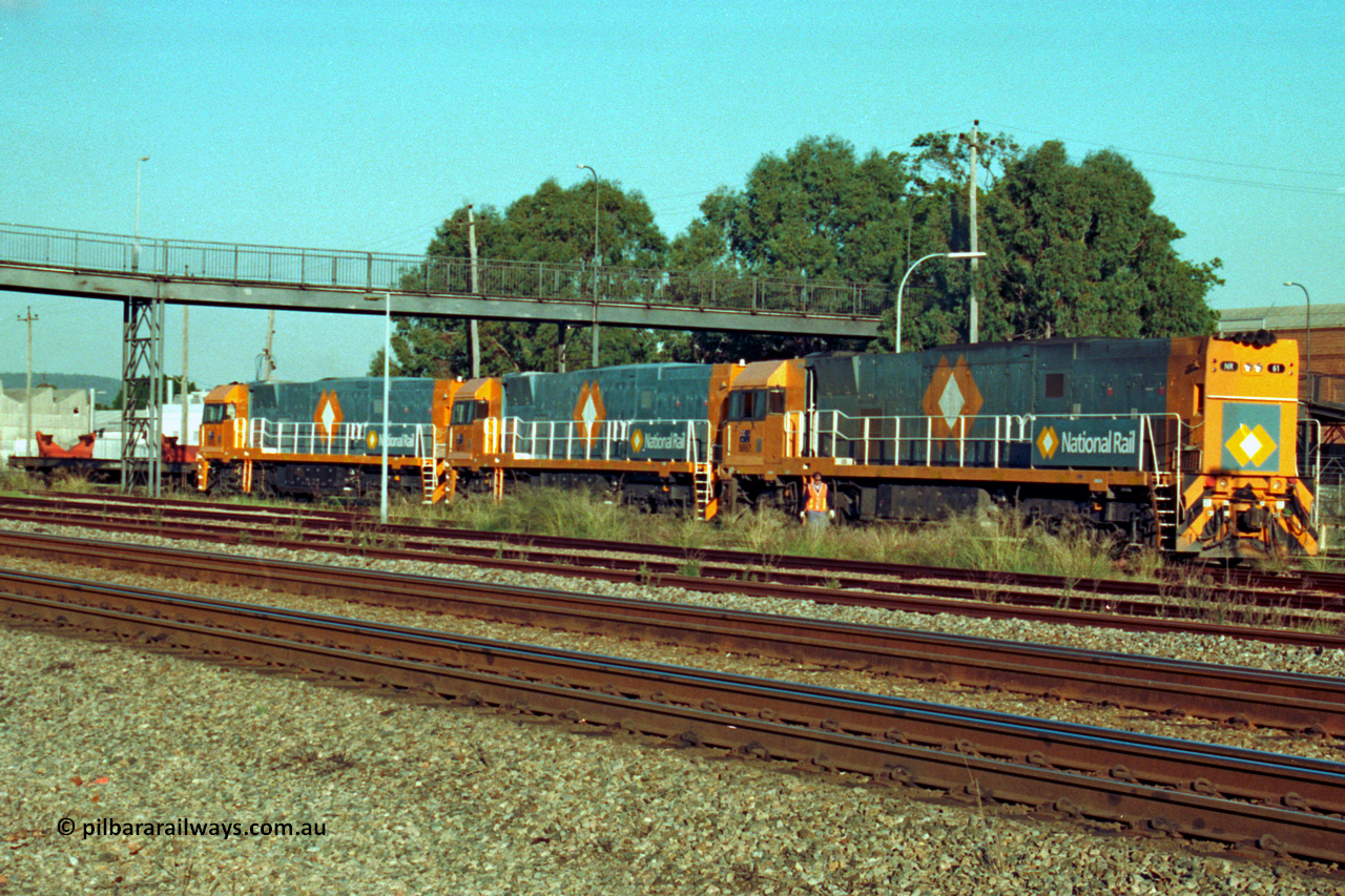 201-24
Midland, the first Perth built NR class NR 61 Goninan GE model Cv40-9i serial 7250-11/96-263 shunts at Midland with two brand new NR units NR 101 and NR 102 with waggon RQRX 60177.
Keywords: NR-class;NR61;Goninan;GE;CV40-9i;7250-11/96-263;