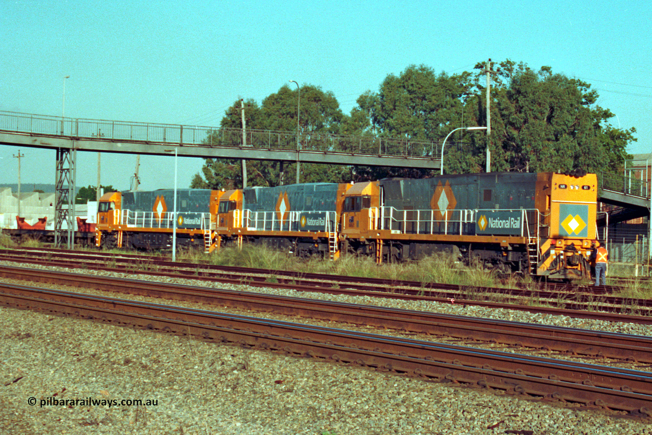 201-25
Midland, the first Perth built NR class NR 61 Goninan GE model Cv40-9i serial 7250-11/96-263 shunts at Midland with two brand new NR units NR 101 and NR 102 with waggon RQRX 60177.
Keywords: NR-class;NR61;Goninan;GE;CV40-9i;7250-11/96-263;
