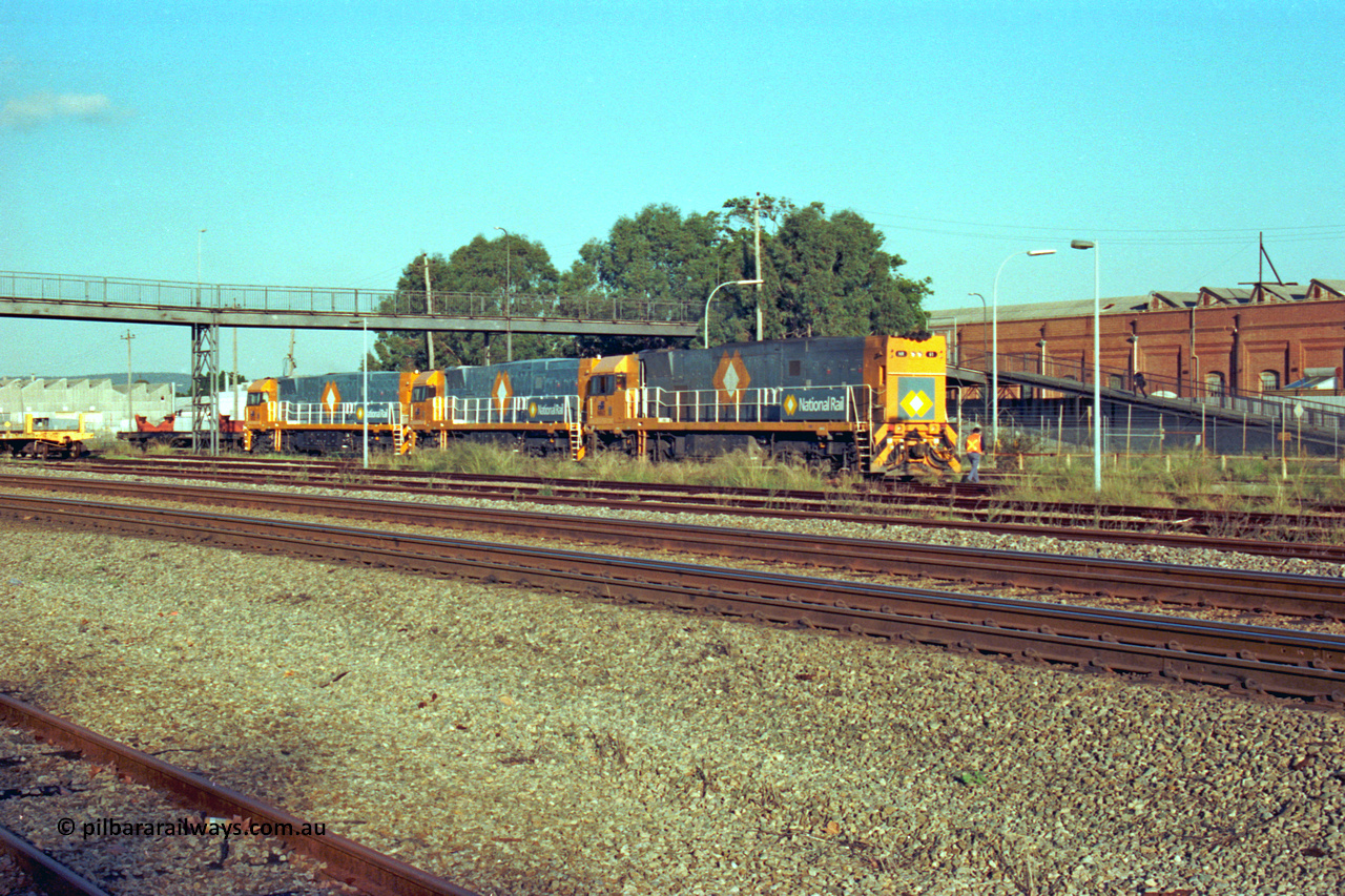 201-26
Midland, the first Perth built NR class NR 61 Goninan GE model Cv40-9i serial 7250-11/96-263 shunts at Midland with two brand new NR units NR 101 and NR 102 with waggon RQRX 60177.
Keywords: NR-class;NR61;Goninan;GE;CV40-9i;7250-11/96-263;
