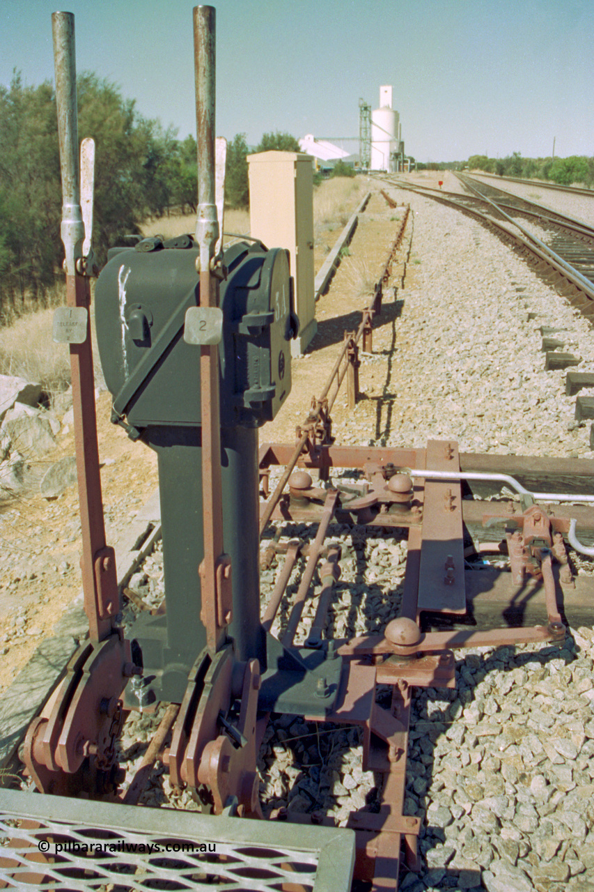 202-12
Meckering, looking east at the interlocking levers #1 and #2 and Pilot Key box 5A for the goods siding and derail at the west end of the crossing loop.

