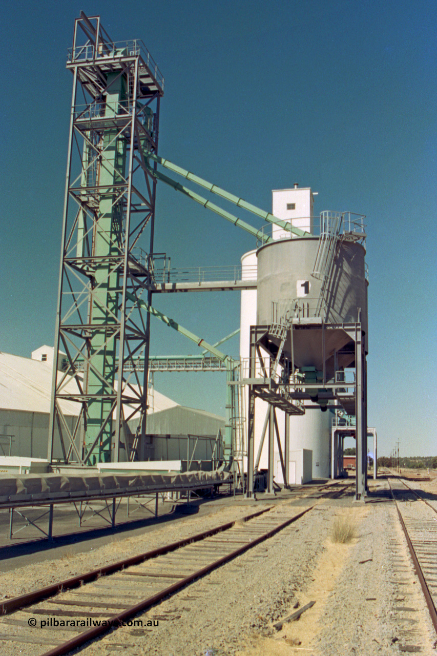 202-16
Meckering, looking east, grain elevator with loadout dual overhead bunker bins with #1 closet to camera, the goods loop is running to the right of the loadout bin.
