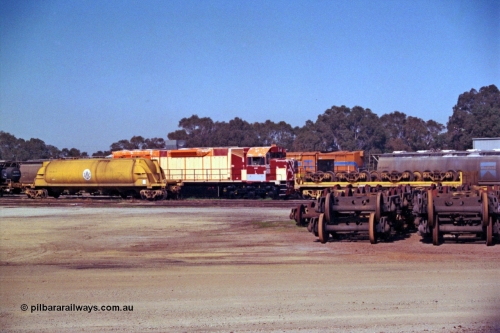 208-2-27
Midland Workshops, Westrail L class L 255 a Clyde Engineering EMD model GT26C, serial 67-545 under overhaul surrounded by various rollingstock including the WSL 30650 bogie transport waggon which was built for this task in 1977 at Midland Workshops.
Keywords: L-class;L255;Clyde-Engineering-Granville-NSW;EMD;GT26C;67-545;WSL-type;WSL30650;