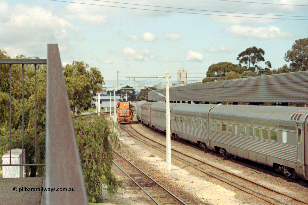 209-01
East Perth Passenger Terminal, Westrail L class L 272 Clyde Engineering EMD model GT26C serial 69-621 shunts flat waggons around the Indian Pacific consist.
