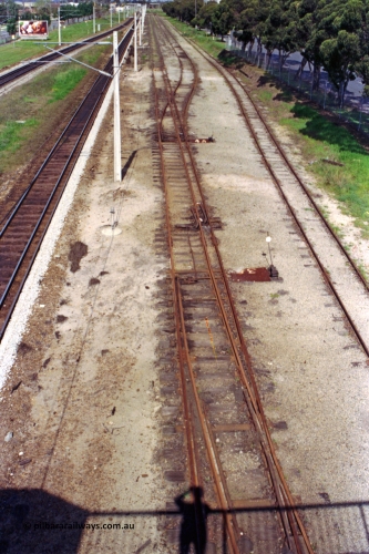 209-11
Ashfield, looking towards Perth from the station overbridge, the dual gauge tracks and yard running between the mainline and Railway Parade on the right. The standard gauge and narrow gauge points are easy to spot.
