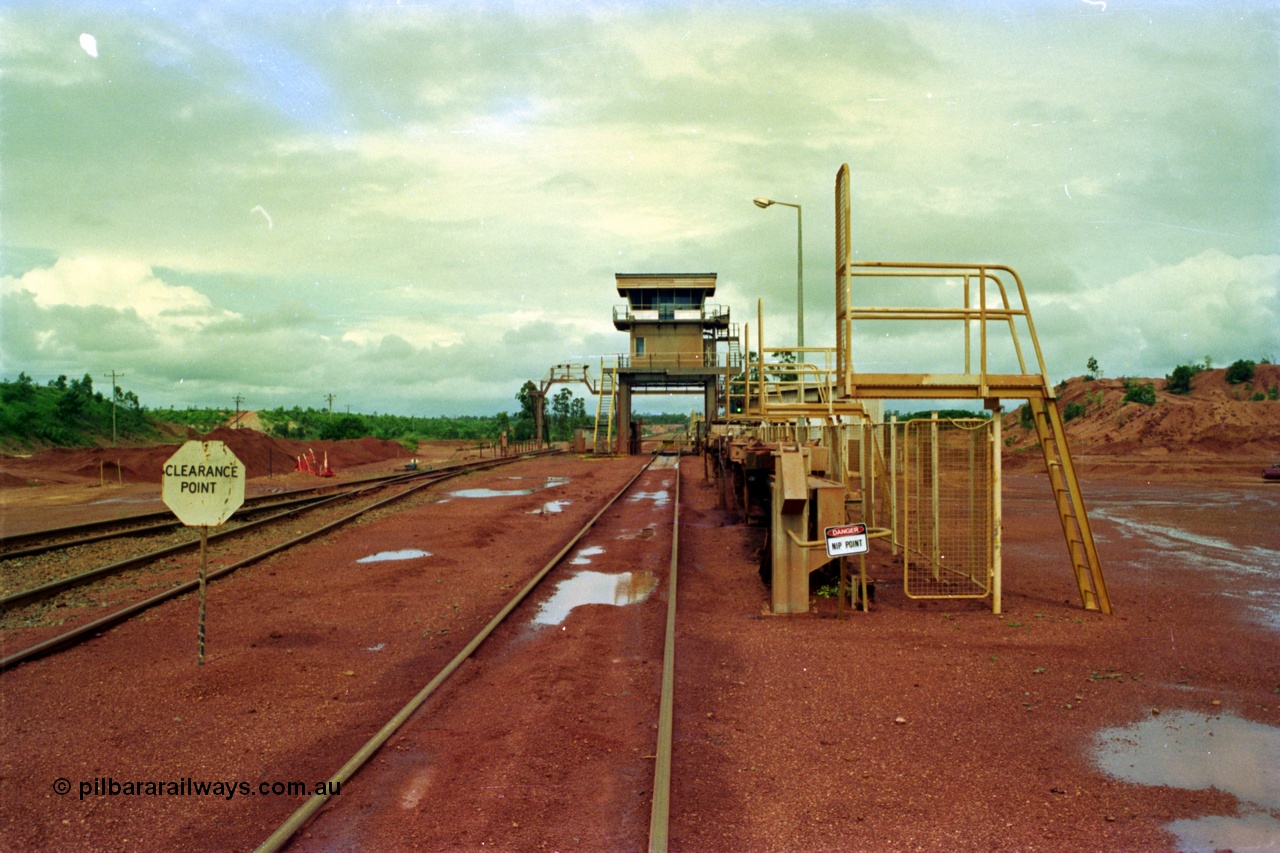 210-00
Weipa, Lorim Point, Comalco rail dump station for unloading the bauxite trains from Andoom mine looking towards Andoom from the workshops end.
