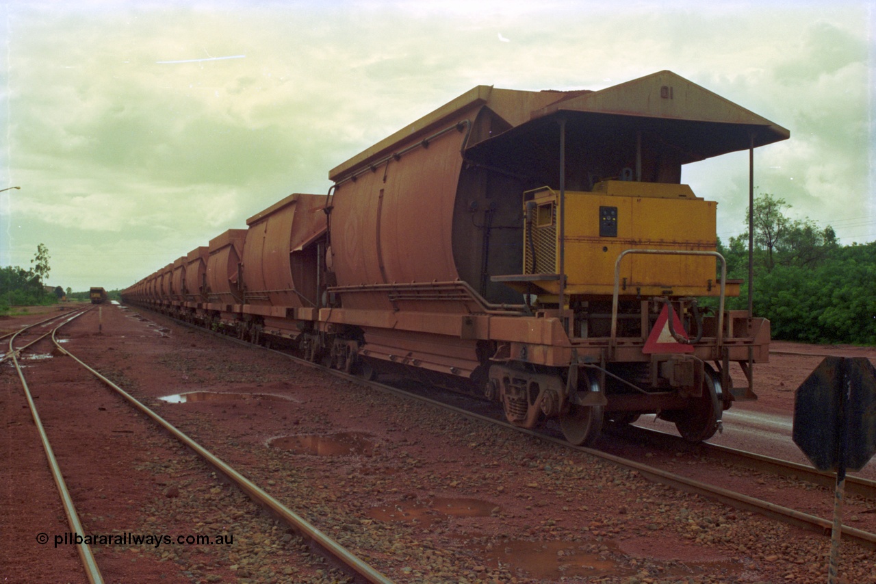 210-05
Weipa, Lorim Point, rake of loaded cars with a compressor car on the rear of the consist closest to camera.
