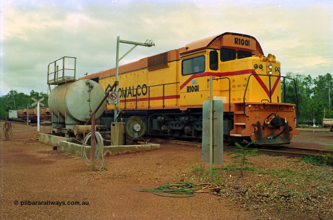 210-08
Weipa, Lorim Point railway workshops, driver side view of Comalco R 1001 loco Clyde Engineering EMD model GT26C serial 72-752 while is sits at the fuel point, items of note are the second 'tropical roof' and the five chime horn cut into the nose. Also noticeable, the units don't have dynamic brakes fitted so there is no brake 'blister' in the middle of the hood like the WAGR L or VR C classes which are also GT26C models.
Keywords: R1001;Clyde-Engineering;EMD;GT26C;72-752;1.001;Comalco;