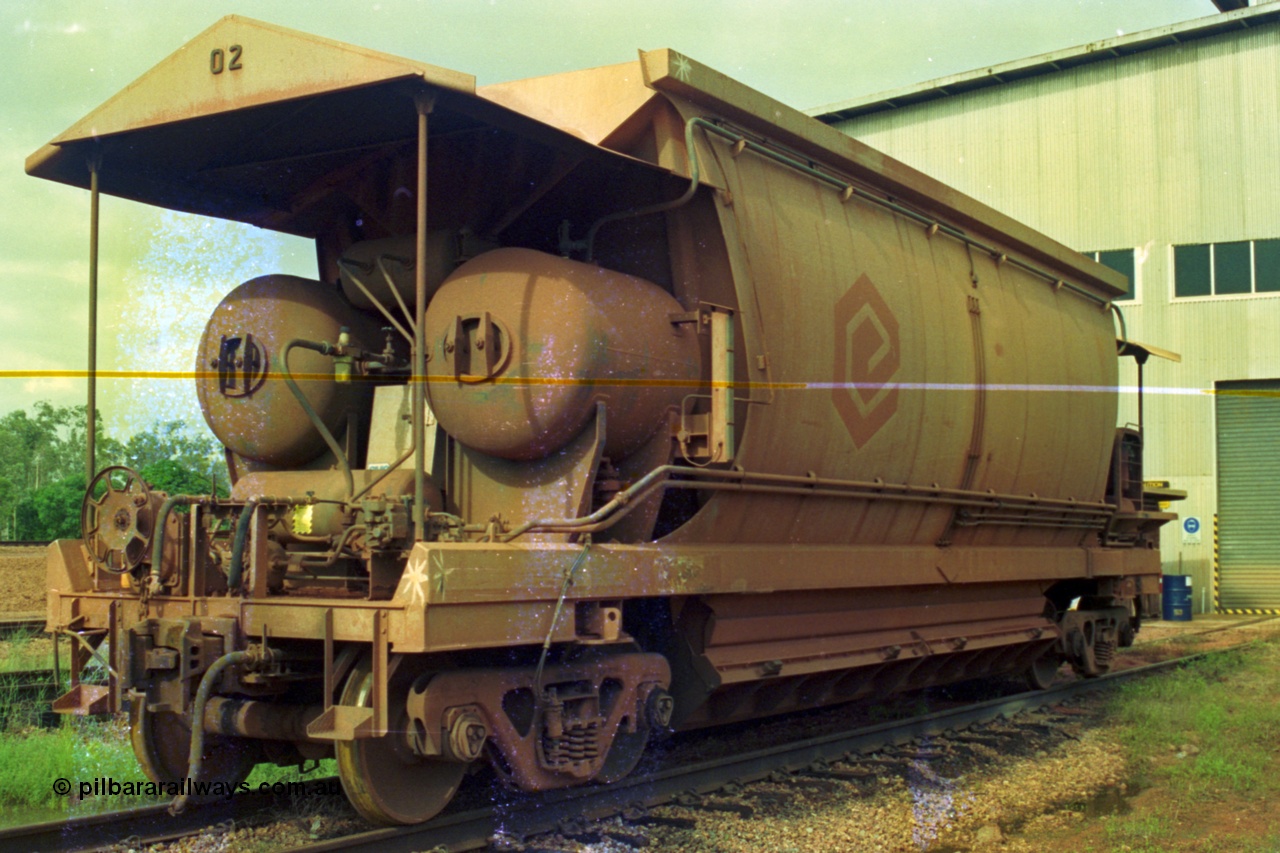 210-22
Weipa, Lorim Point railway workshops, side view of Comalco ore waggon 3002, shows handbrake, triple valve and piping, side piping and controls, bogies and discharge doors and air receivers, this is one of the compressor equipped waggons.
Keywords: HMAS-type;Comeng-Qld;Comalco;