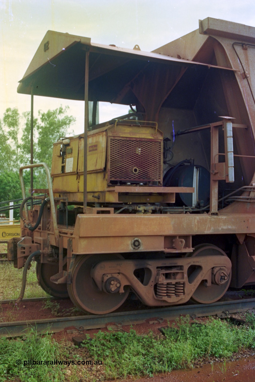210-24
Weipa, Lorim Point railway workshops, view of compressor end of Comalco ore waggon 3002, shows compressor, fuel tank, controls and piping and bogie.
Keywords: HMAS-type;Comeng-Qld;Comalco;