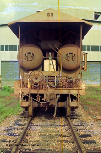 210-21
Weipa, Lorim Point railway workshops, rear view of Comalco ore waggon 3002, shows handbrake, triple valve and piping and air receivers, this is one of the compressor equipped waggons.
Keywords: HMAS-type;Comeng-Qld;Comalco;