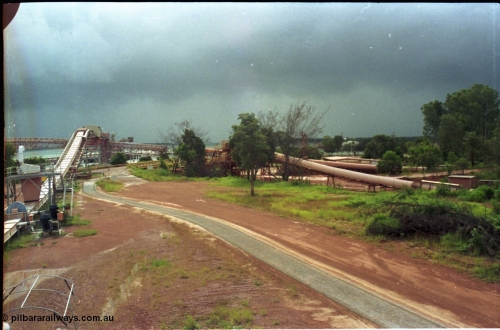 211-10
Weipa, view from bottom of the kaolin silos looking towards the mouth of the Embley River with the bauxite wharf and kaolin feed conveyor associated infrastructure.
